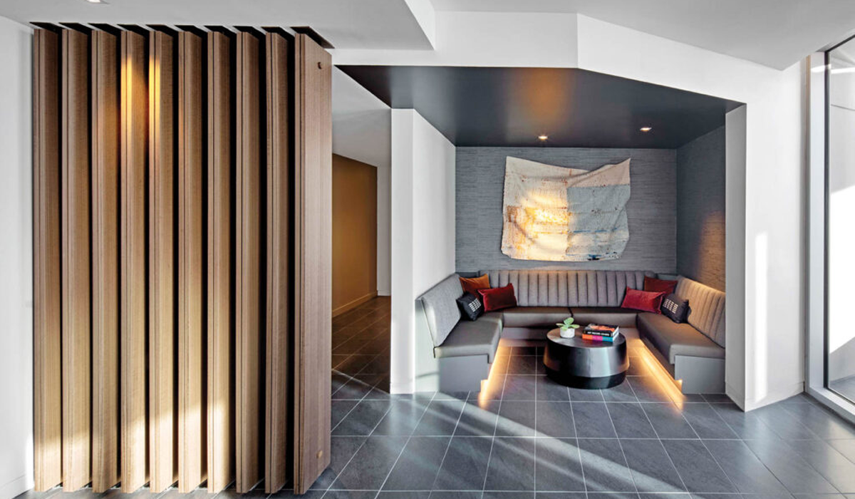 a lobby in a residential complex with a seating nook