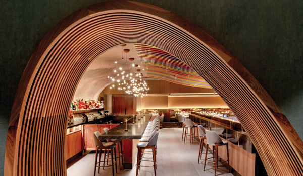 An arched walnut portal to a restaurant