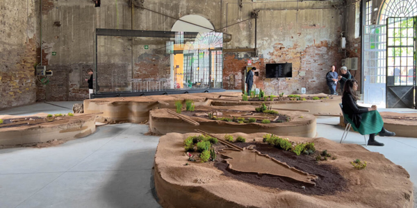 A warehouse with sculptures illustrating climate impact