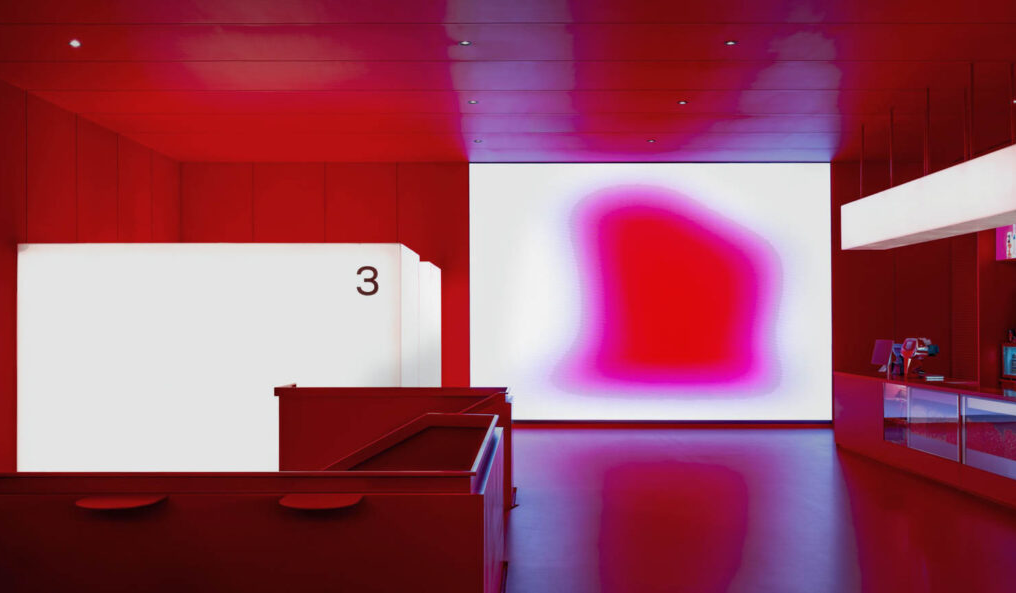 the lobby of a red-lit theater