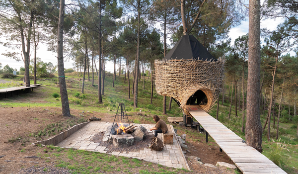 an a-frame cabin in the woods