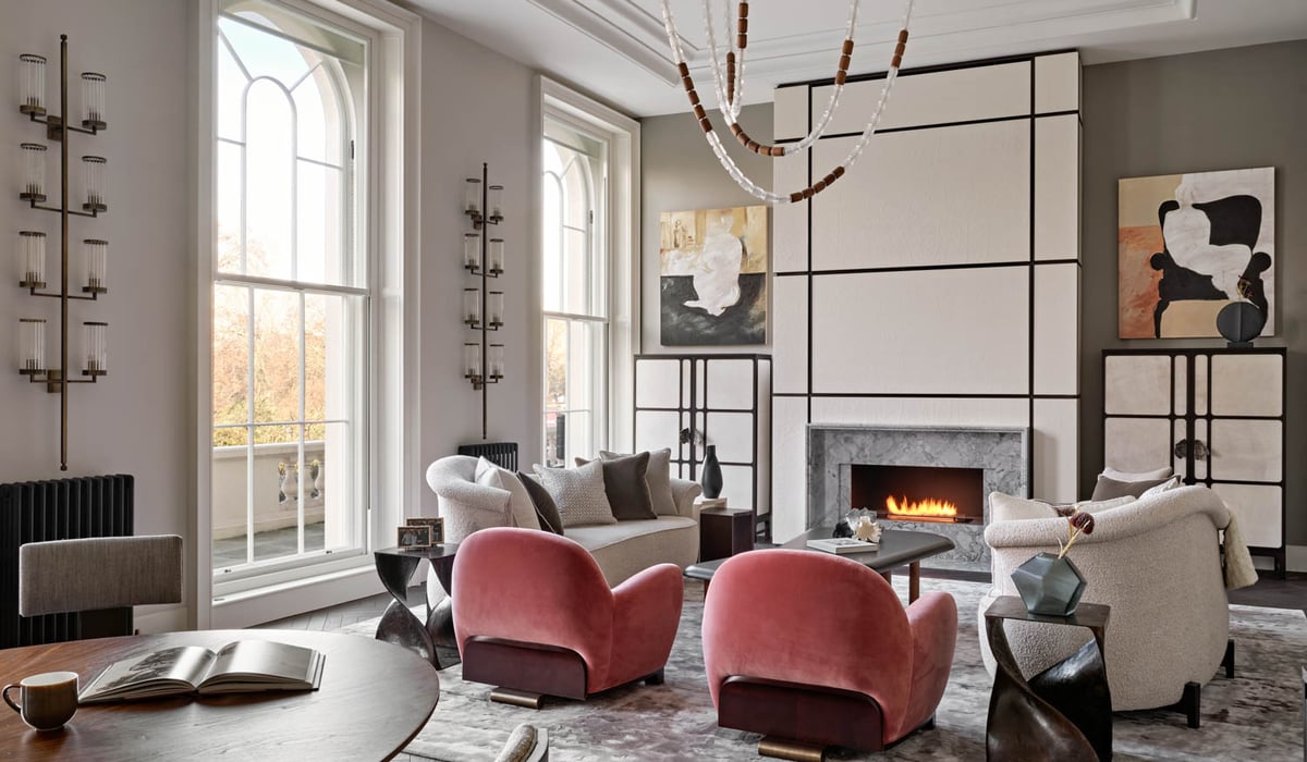 pink accent chairs and white sofas in a living room
