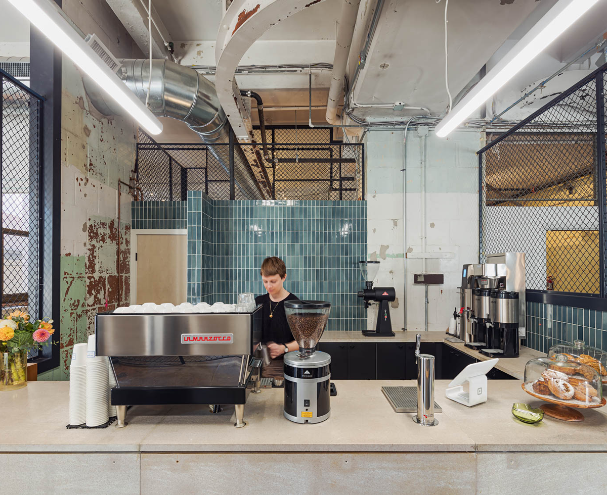 a barista makes coffee