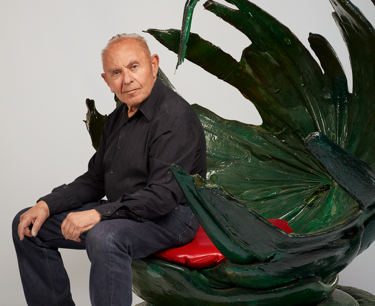 Louis Durot sitting in one of his creations
