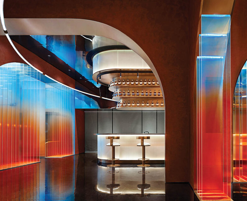 blue and red lights illuminate a bar