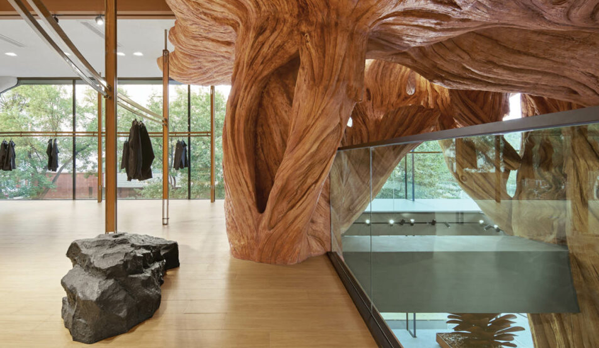 a tree sculpture inside an outdoor apparel store