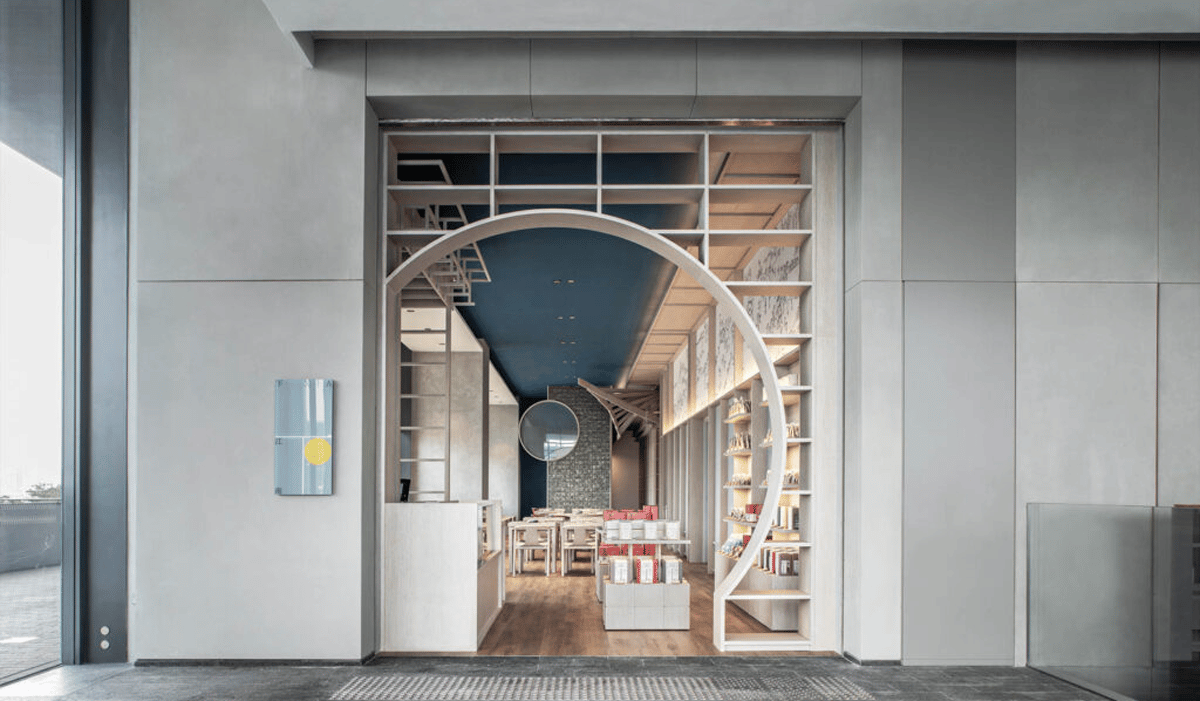 a teahouse with a keyhole doorway and shelves of tea