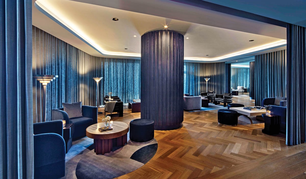 dining space of The Morrow Hotel with midnight blue furnishings