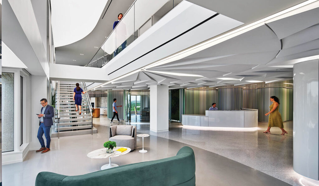 office space with high ceilings and green couches