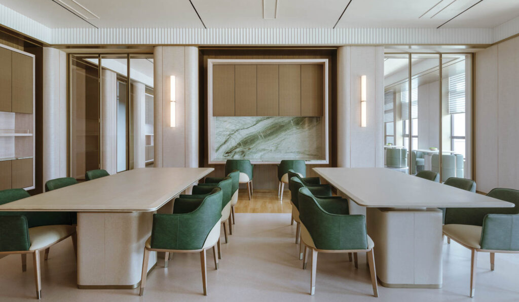 conference room with neutral walls and green chairs