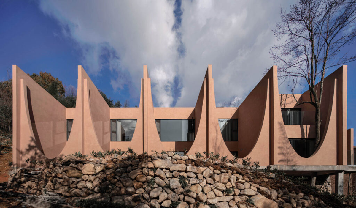 outdoor view of two-story suites in hotel in the mountains