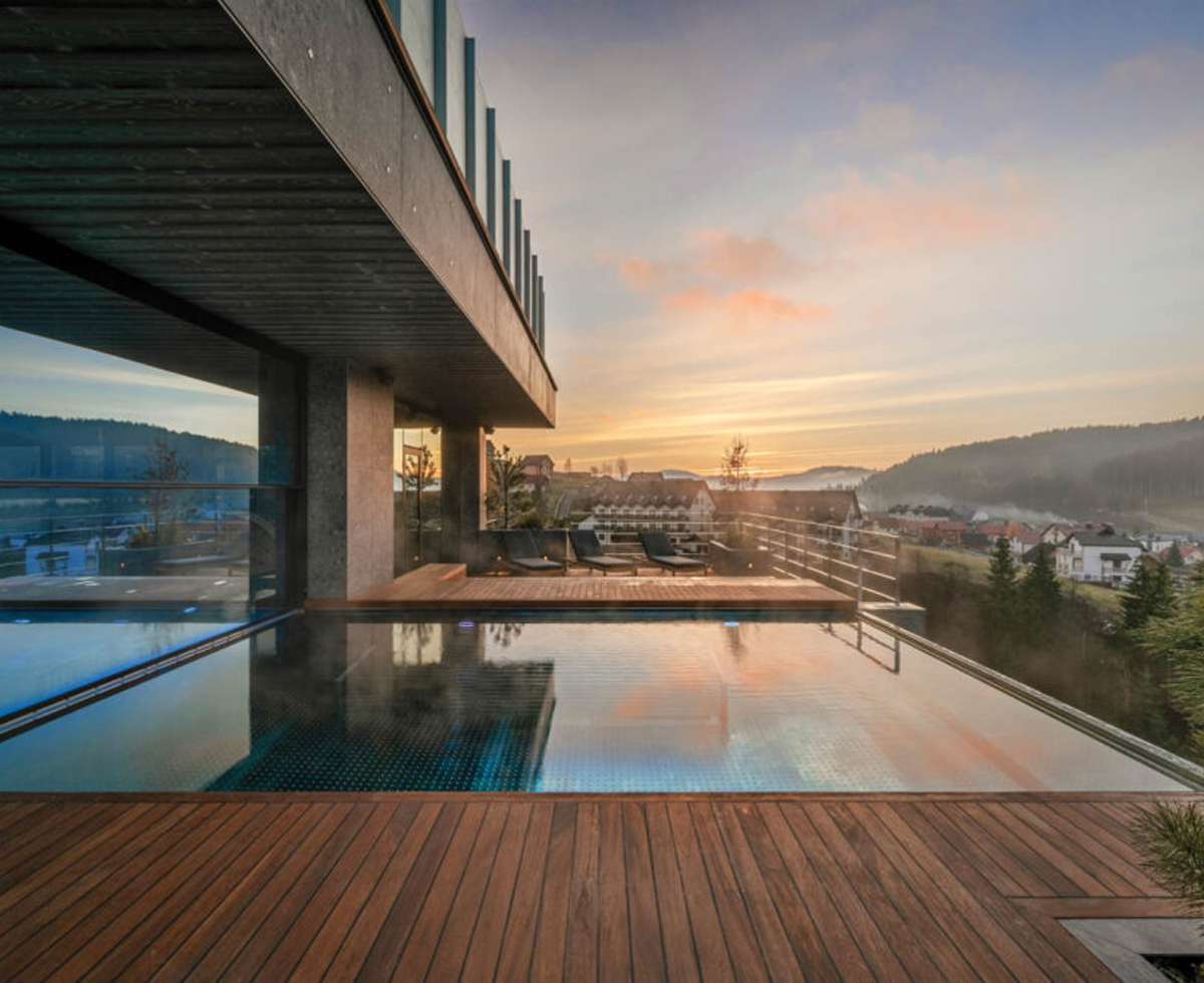 outdoor pool in a resort overlooking the mountains