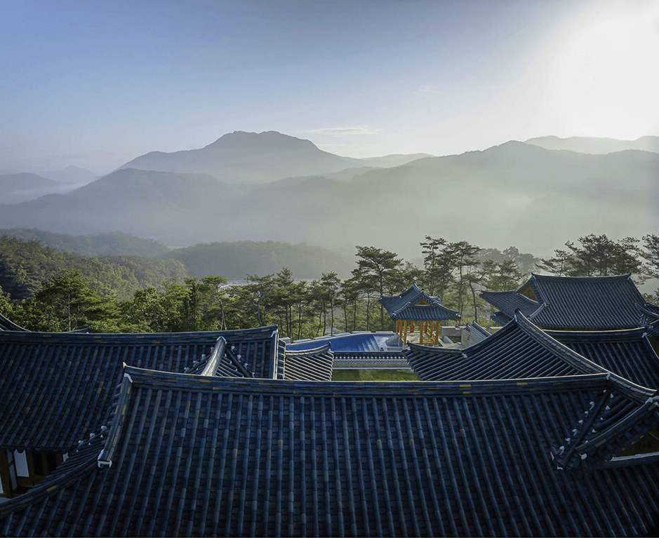 a view from the roof of the Hanok Heritage House overlooking mountains