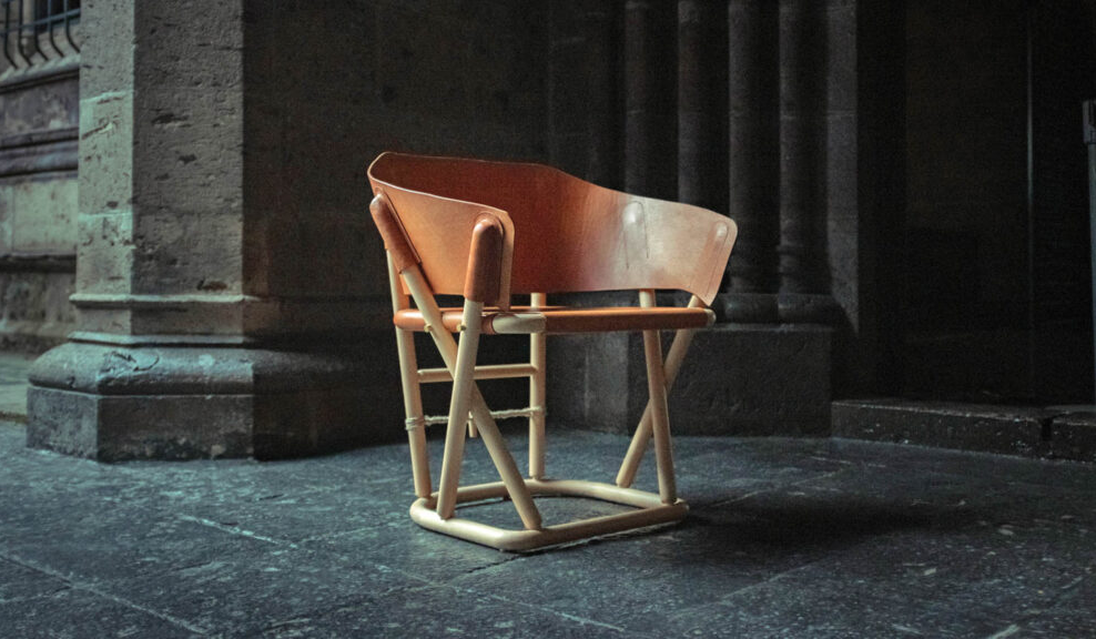 a wooden curved armchair with raised legs