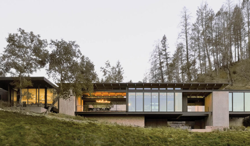 facade of single-level country home surrounded by trees