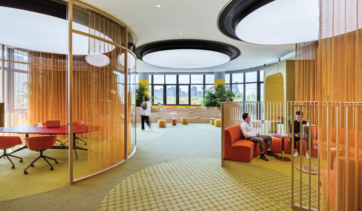 office space with orange barricades and multiple circle motifs for collaboration