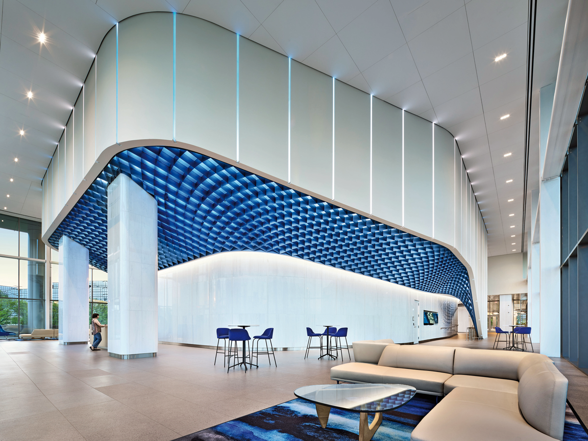 an office common area with blue stools