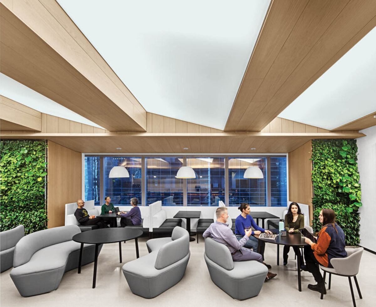 TPG Architecture communal area with sofas and greenery