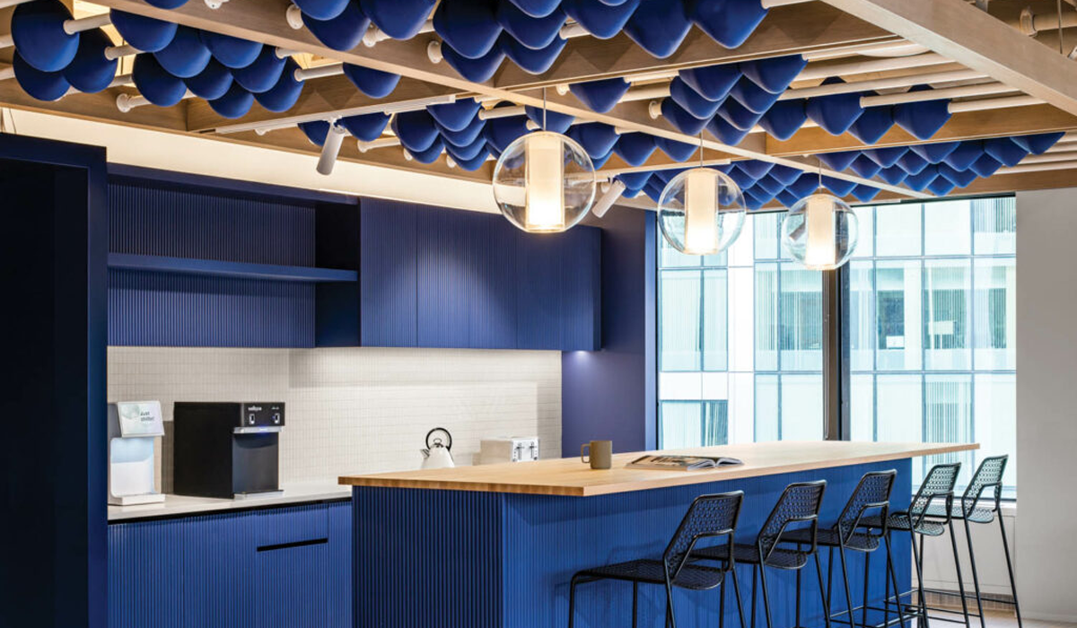 kitchen with blue cabinets and island with an abacus-inspired ceiling