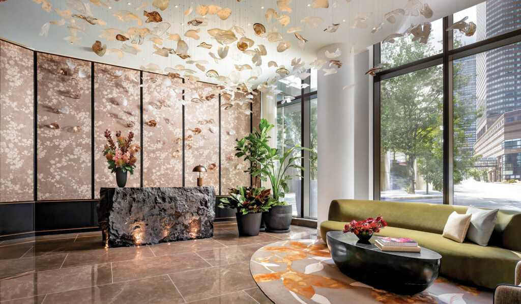 living room with chandelier with gold leaves and outdoor view