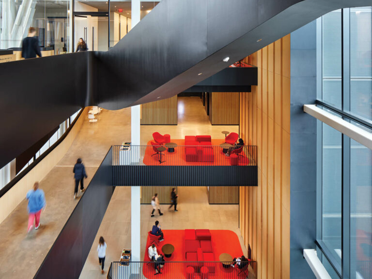 a BU facility with a winding black staircase and red furniture
