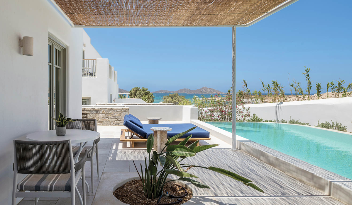a pool deck with ocean views in greece