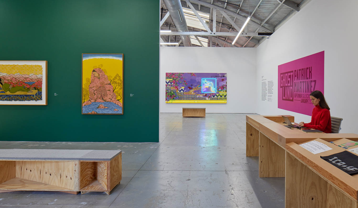 an art studio space with a green accent wall