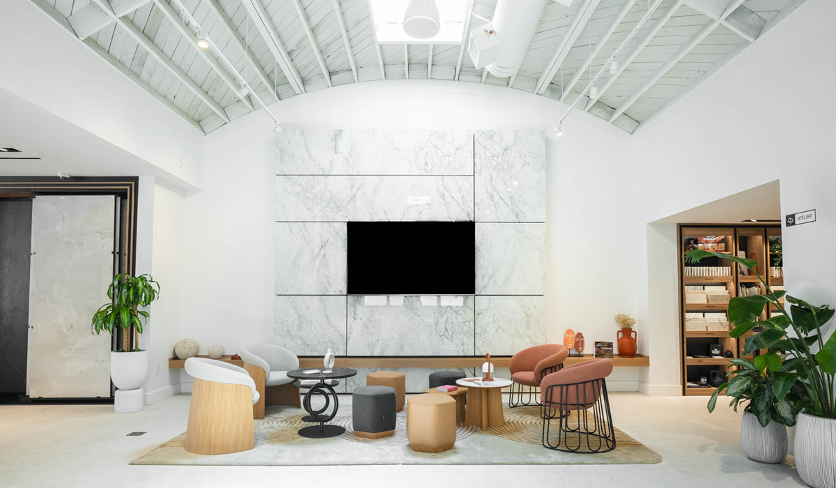 Cosentino showroom with seating area, marble backdrop and library