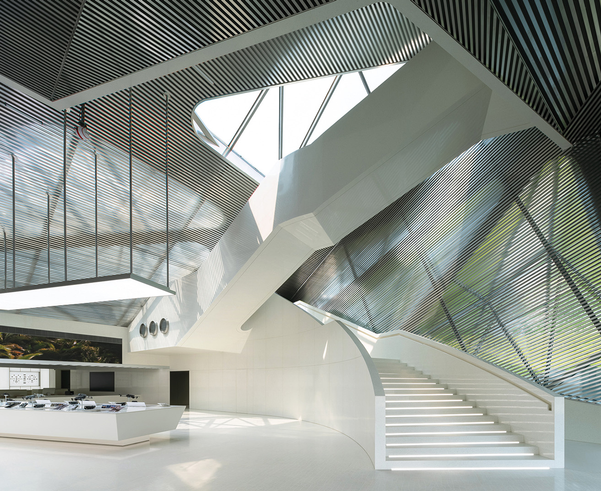 retail storefront interior with white stairs and metal panels