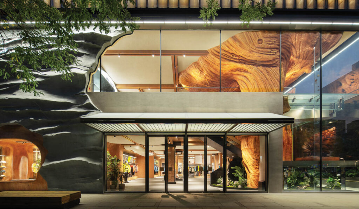 exterior of storefront with view of large rock climbing wall