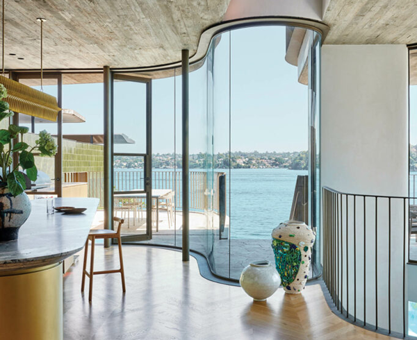 oak flooring in kitchen that opens to a terrace