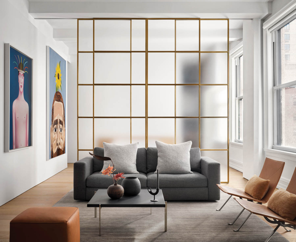 sliding frosted-glass panels in a living room with gray couches