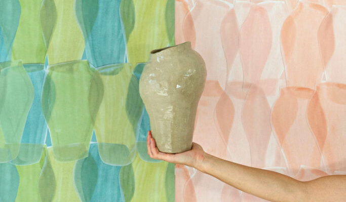 ceramic pot in front of wallpaper