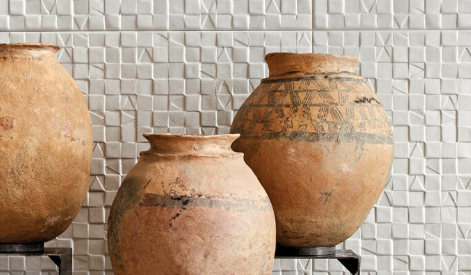 ceramic pots against a tile wall