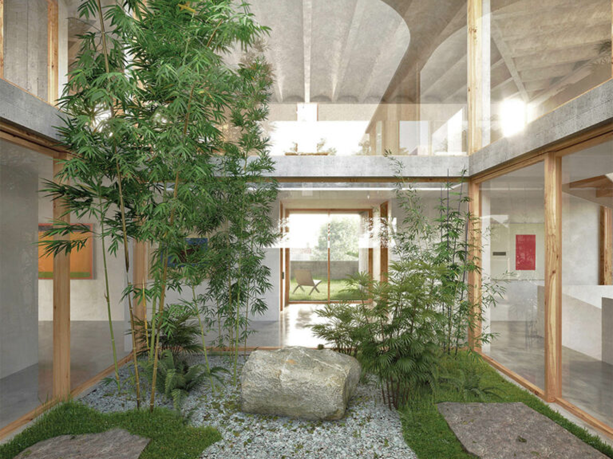 an indoor courtyard with leafy trees