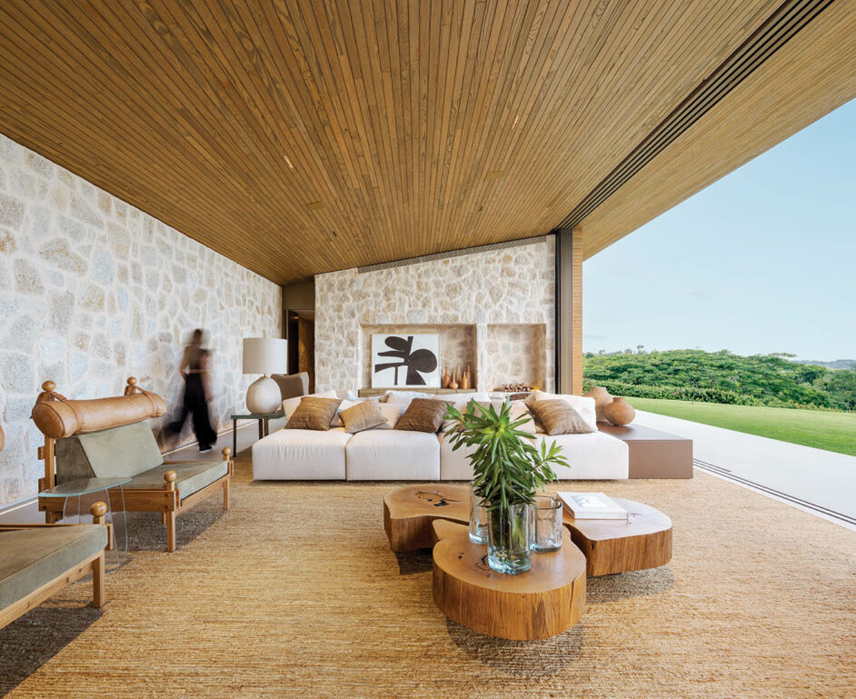 an indoor-outdoor living room with earthy textures