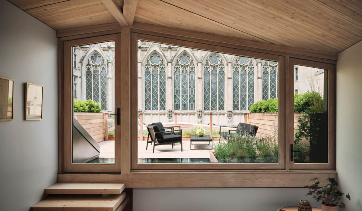 sitting room with view to outdoor scenery and wooden framed windows