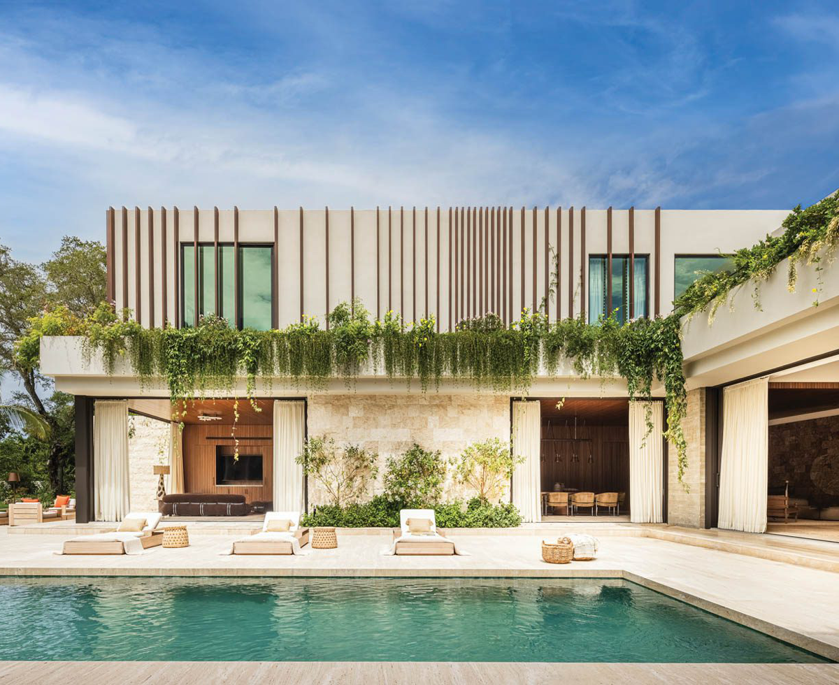 modernist home with pool and lots of ivy