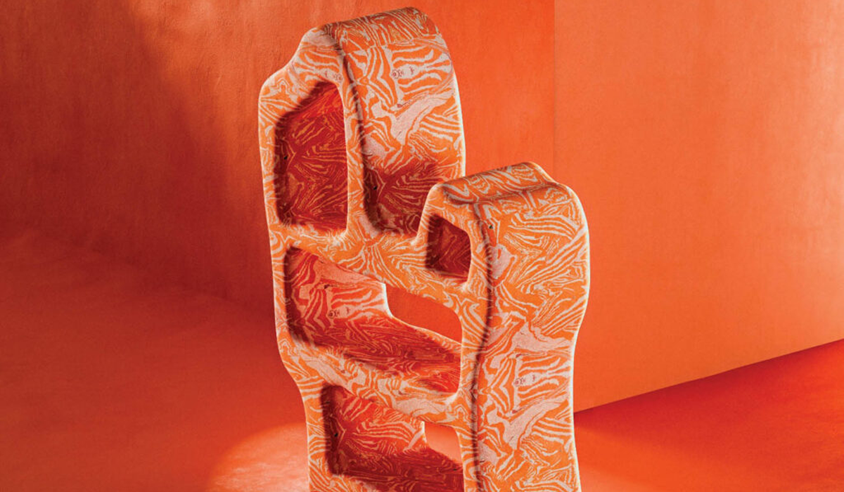 orange marbled bookshelf against an orange background