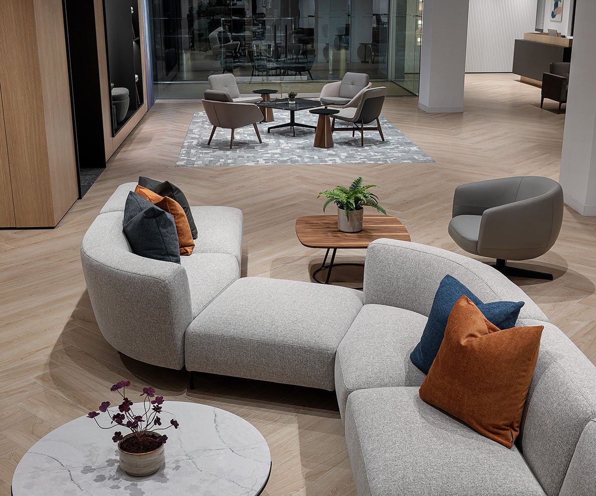 Keilhauer showroom lounge area with sofa, tables, and chairs